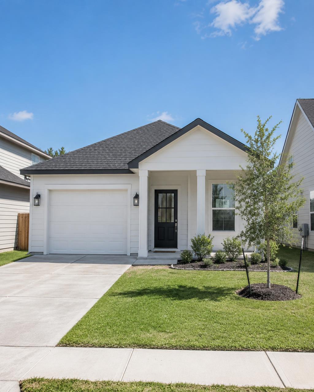 A small white HardiePlank home in a Pflugerville neighborhood